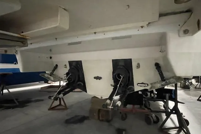 Slide: The Image of 2017 Formula 350 Crossover Bowrider boat underside with dual outdrives in storage. - 7