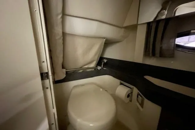 Slide: The Image of 2017 Formula 350 Crossover Bowrider bathroom interior with toilet and mirror. - 72