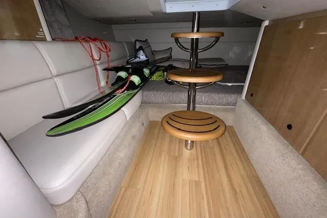 Slide: The Image of 2017 Formula 350 Crossover Bowrider cabin with water skis and wooden steps. - 75