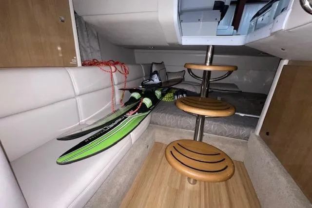 Slide: The Image of 2017 Formula 350 Crossover Bowrider cabin with water skis and wooden steps. - 76