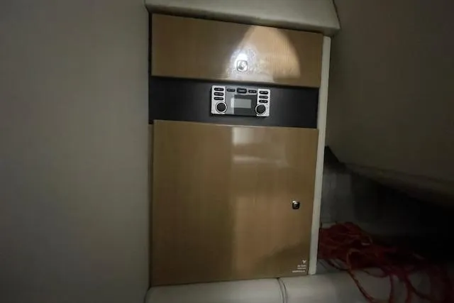 Slide: The Image of 2017 Formula 350 Crossover Bowrider interior with control panel and storage. - 78