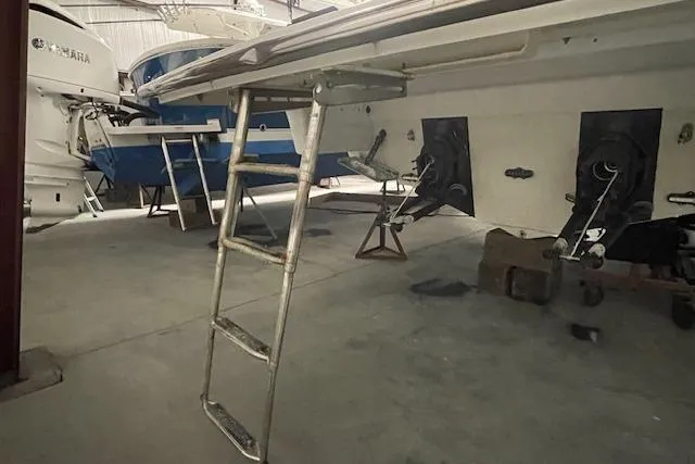 Slide: The Image of 2017 Formula 350 Crossover Bowrider in storage with ladder and propellers visible. - 8