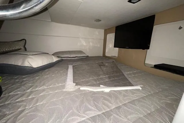 Slide: The Image of 2017 Formula 350 Crossover Bowrider cabin interior with bed and TV. - 81