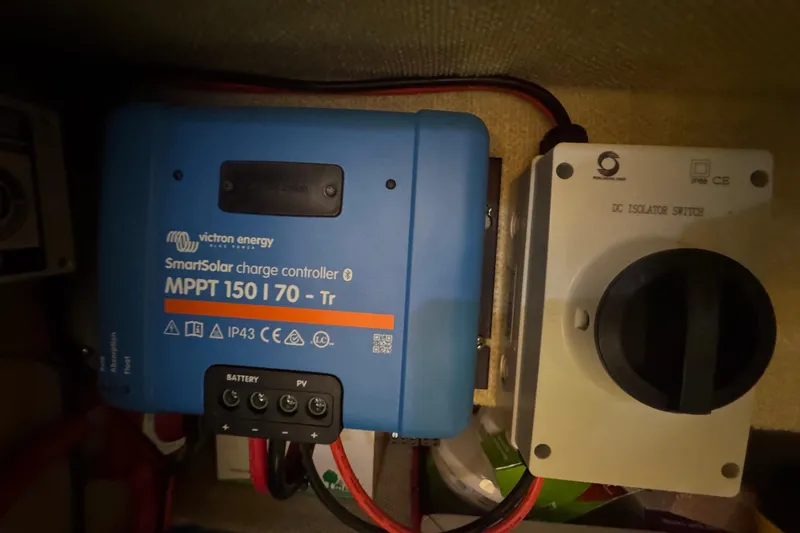 Slide: The Image of 1986 Carver 42 Aft Cabin Motor Yacht bathroom with sink, toilet, and wooden cabinetry. - 105