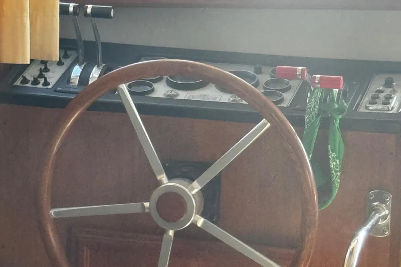 Slide: The Image of Steering wheel and controls of 1986 Carver 42 Aft Cabin Motor Yacht. - 23
