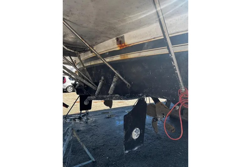 Slide: The Image of Engine room of 1986 Carver 42 Aft Cabin Motor Yacht with various equipment and tools. - 51