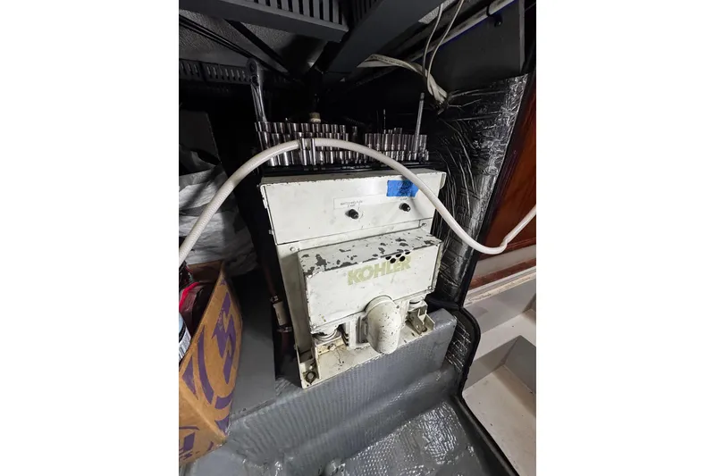 Slide: The Image of Interior of 1986 Carver 42 Aft Cabin Motor Yacht with cozy seating and nautical decor. - 54