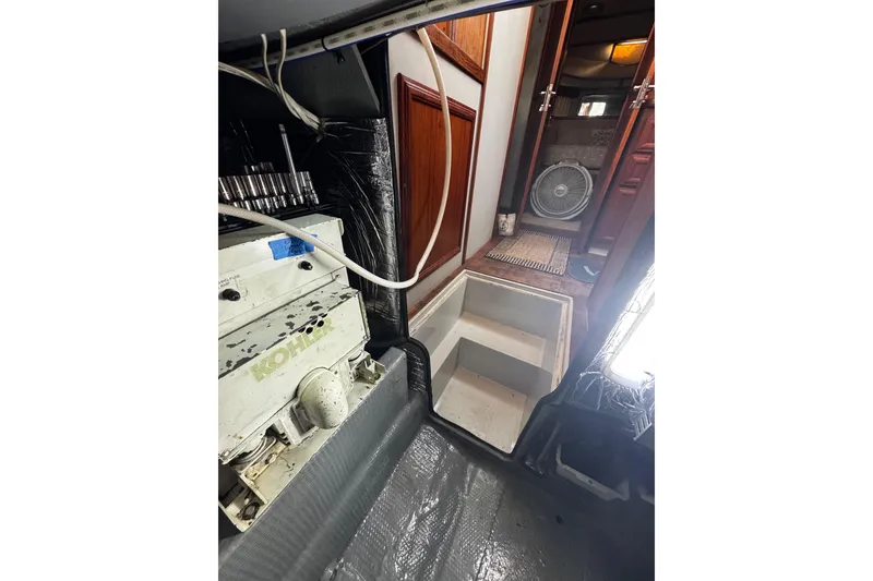 Slide: The Image of Interior of 1986 Carver 42 Aft Cabin Motor Yacht with cozy seating and nautical decor. - 55