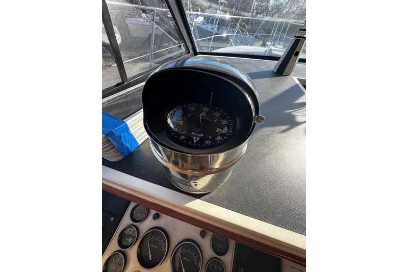 Slide: The Image of Interior of 1986 Carver 42 Aft Cabin Motor Yacht with cozy seating and nautical decor. - 63