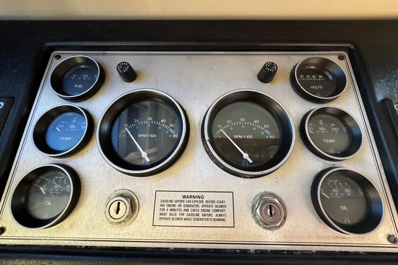 Slide: The Image of Control panel of a 1986 Carver 42 Aft Cabin Motor Yacht, featuring various switches and meters. - 64