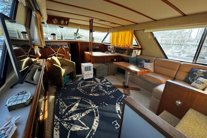 Slide: The Image of 1986 Carver 42 Aft Cabin Motor Yacht kitchen with wood cabinetry and modern appliances. - 70