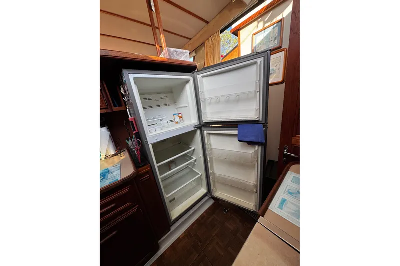 Slide: The Image of Cozy cabin interior of 1986 Carver 42 Aft Cabin Motor Yacht with nautical decor. - 81