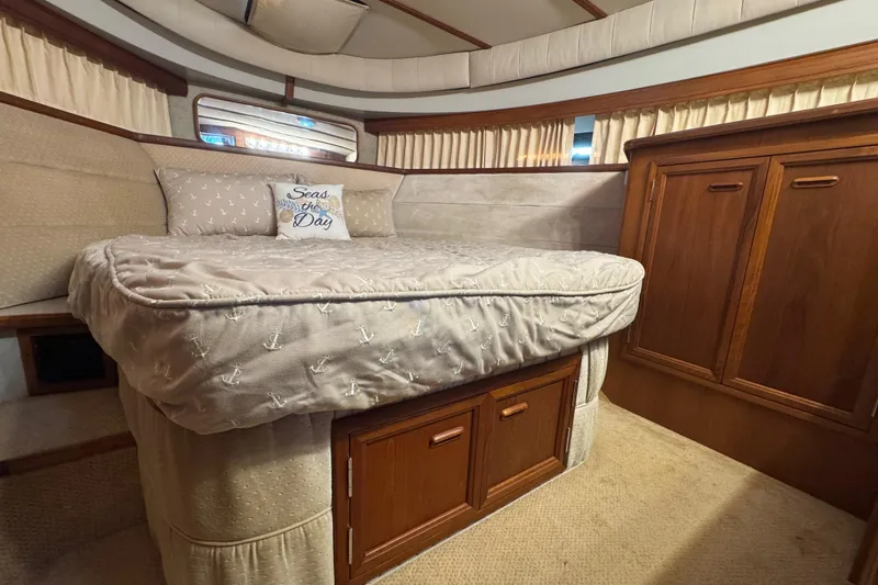 Slide: The Image of Toilet in 1986 Carver 42 Aft Cabin Motor Yacht bathroom with wooden flooring. - 87
