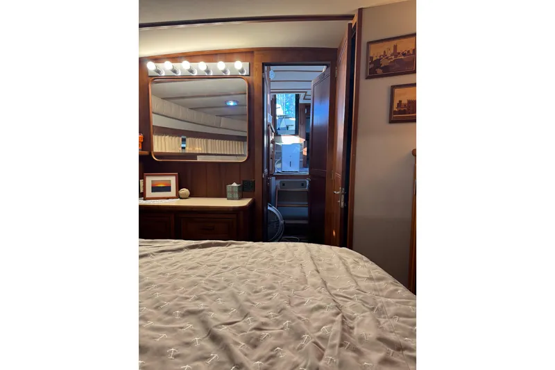 Slide: The Image of Shower area in 1986 Carver 42 Aft Cabin Motor Yacht with toiletries and cleaning supplies. - 89