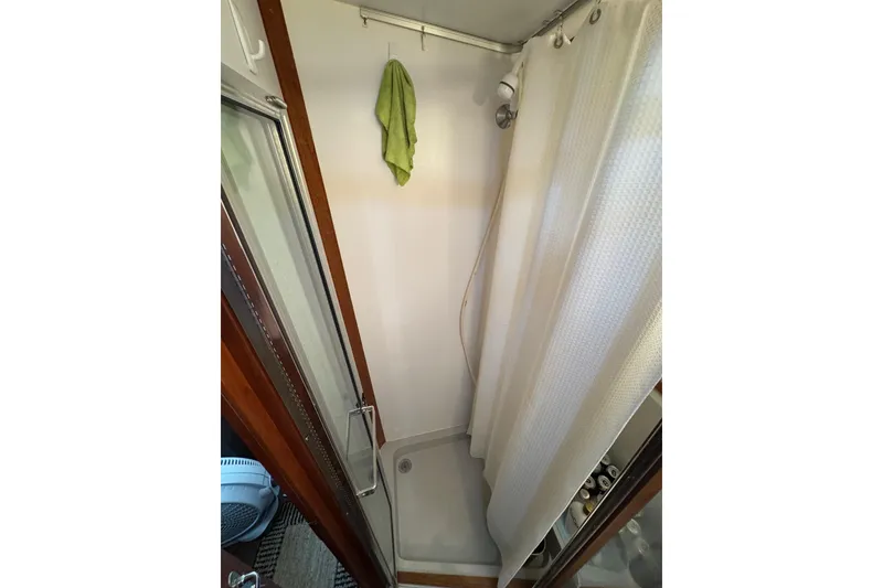 Slide: The Image of 1986 Carver 42 Aft Cabin Motor Yacht interior with electrical panel and storage. - 95