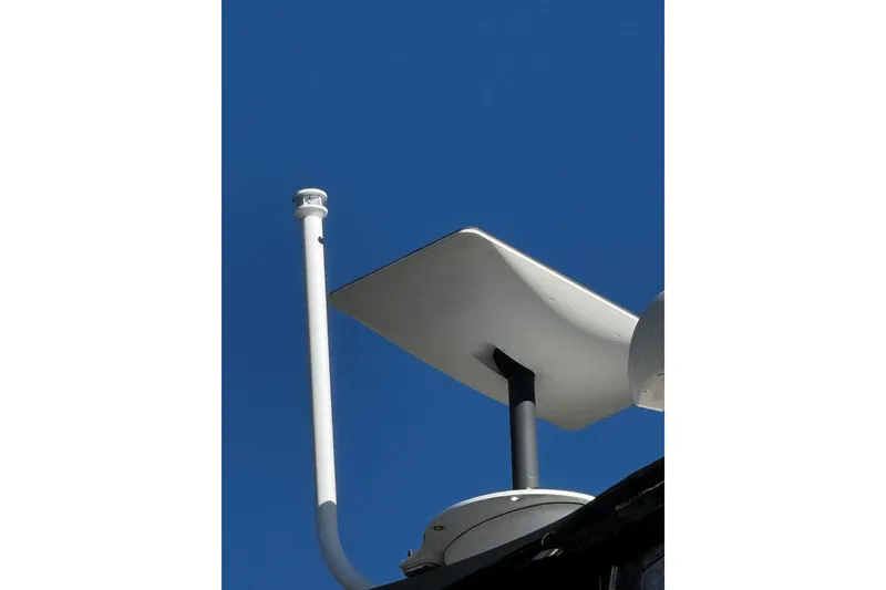 Slide: The Image of 1986 Carver 42 Aft Cabin Motor Yacht with Raymarine radar against clear blue sky. - 48