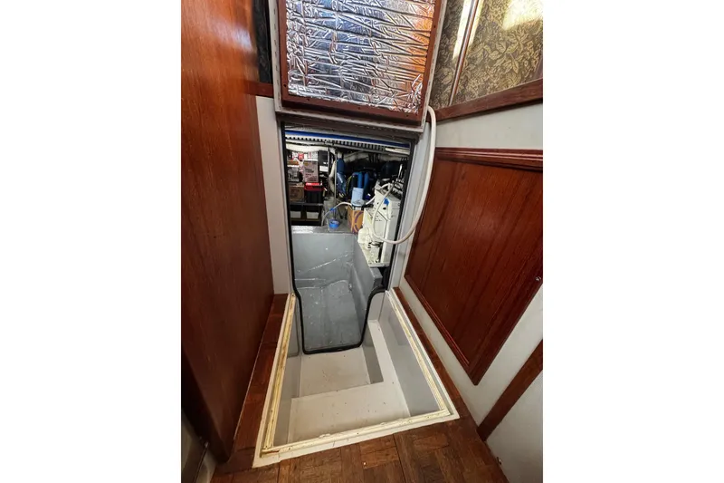 Slide: The Image of Interior of 1986 Carver 42 Aft Cabin Motor Yacht with cozy seating and nautical decor. - 52