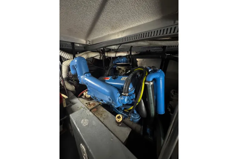 Slide: The Image of Instrument panel of a 1986 Carver 42 Aft Cabin Motor Yacht with gauges and warning label. - 57