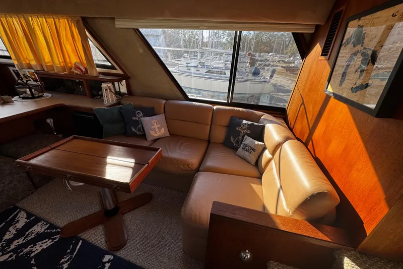 Slide: The Image of Luxurious interior of 1986 Carver 42 Aft Cabin Motor Yacht with cozy seating and nautical decor. - 62