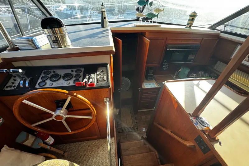 Slide: The Image of Flat-screen TV inside 1986 Carver 42 Aft Cabin Motor Yacht, with outdoor view. - 68