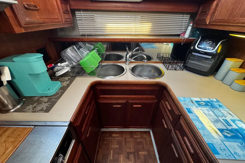 Slide: The Image of V-Berth , looking out into the hallway Interior of 1986 Carver 42 Aft Cabin Motor Yacht with cozy bedroom and vanity. - 82