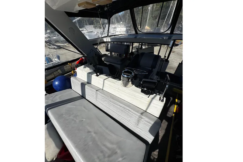 Slide: The Image of 1986 Carver 42 Aft Cabin Motor Yacht on dry dock under clear blue sky. - 9