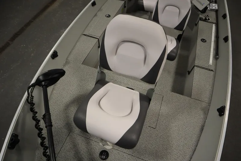 Slide: The Image of 2024 Starcraft Patriot 14 TL boat interior with seating and trolling motor. - 17