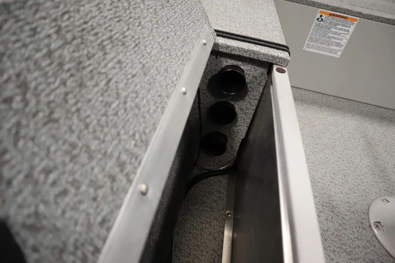 Slide: The Image of 2024 Starcraft Patriot 14 TL interior detail with textured surfaces and wiring. - 22