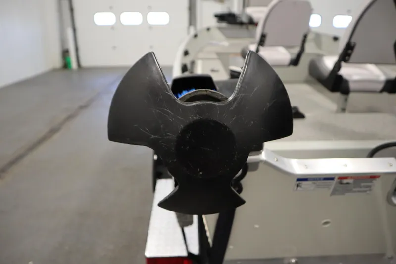 Slide: The Image of 2024 Starcraft Patriot 14 TL boat propeller in a garage setting. - 33