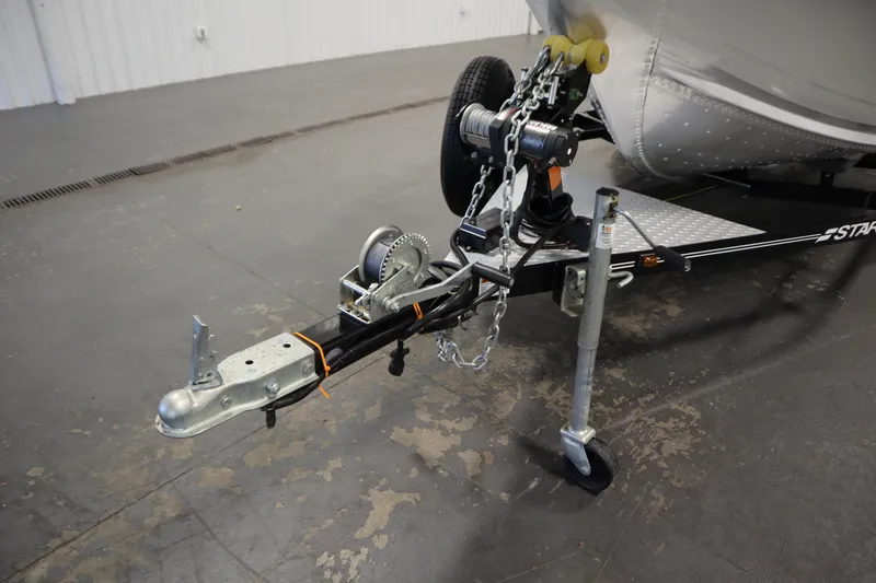 Slide: The Image of 2024 Starcraft Patriot 14 TL trailer hitch and winch in a garage setting. - 39