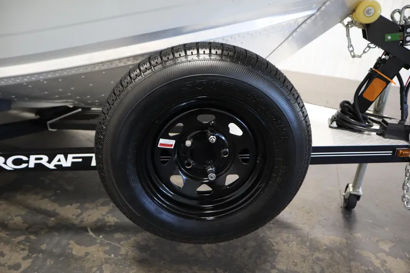 Slide: The Image of 2024 Starcraft Patriot 14 TL trailer wheel and tire close-up. - 40