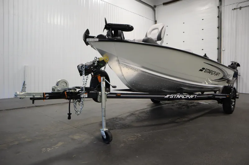 Slide: The Image of 2024 Starcraft Patriot 14 TL boat on trailer in indoor setting. - 41