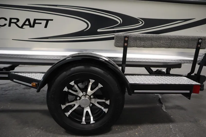 Slide: The Image of 2024 Starcraft Patriot 14 TL trailer with sleek design and durable wheel. - 42