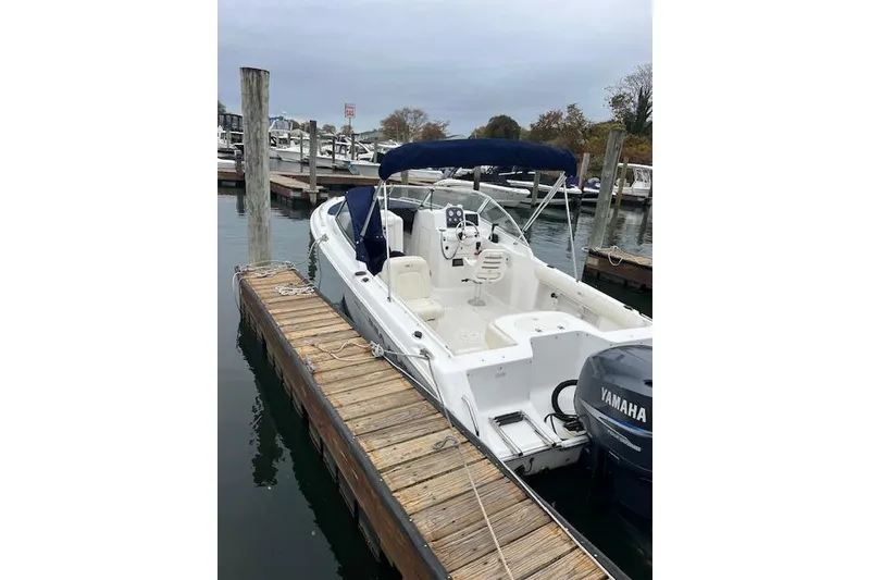 Slide: The Image of 2007 Sea Hunt Escape 220 boat docked with Yamaha outboard motor. - 3