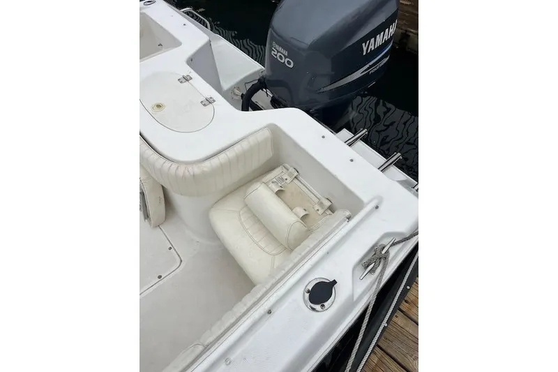Slide: The Image of 2007 Sea Hunt Escape 220 boat with Yamaha 200 engine, docked at marina. - 4