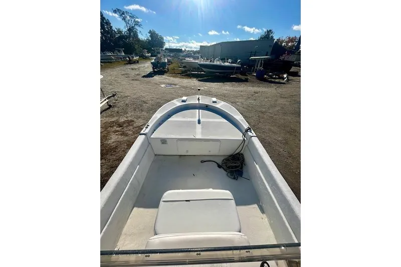 Slide: The Image of 2009 Carolina Skiff JVX18CC boat interior view under sunny sky. - 4