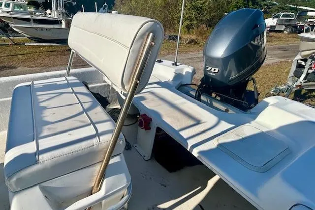 Slide: The Image of 2009 Carolina Skiff JVX18CC boat interior with seating and outboard motor. - 6