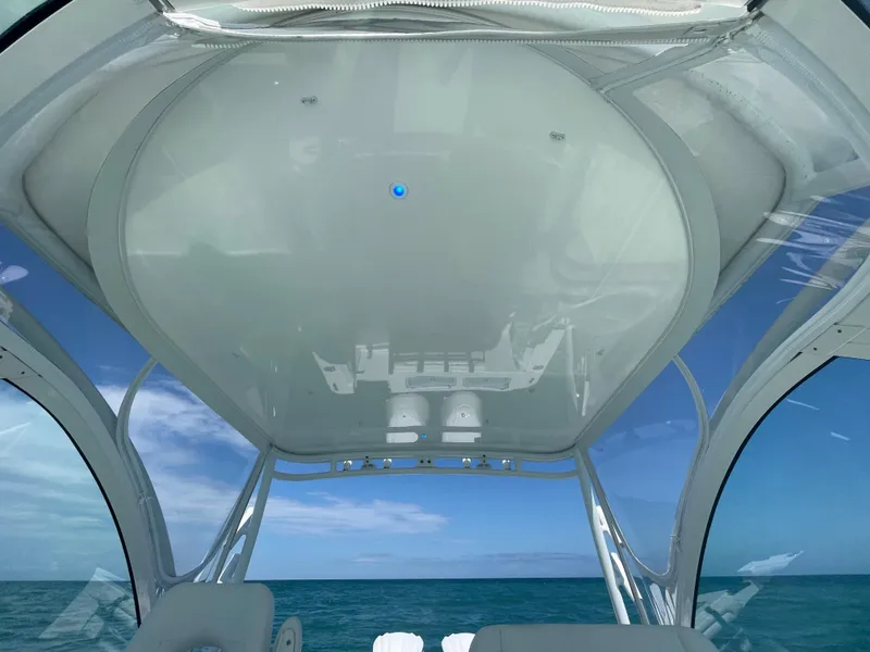 Slide: The Image of 2022 Albemarle 27 DC boat interior with ocean view through clear canopy. - 17