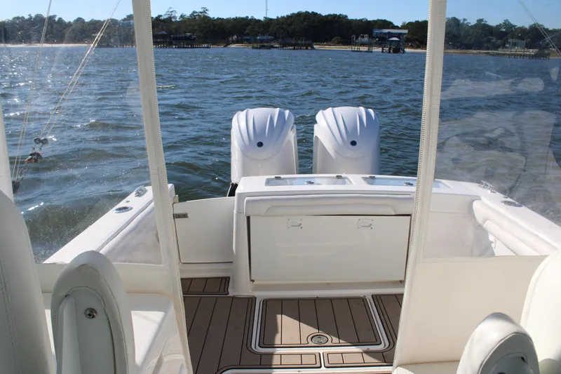 Slide: The Image of 2022 Albemarle 27 DC boat with dual engines on calm water. - 40