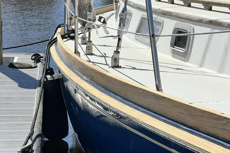 Slide: The Image of 1987 Bristol 41.1 Aft Cockpit sailboat docked, showcasing sleek design and craftsmanship. - 4