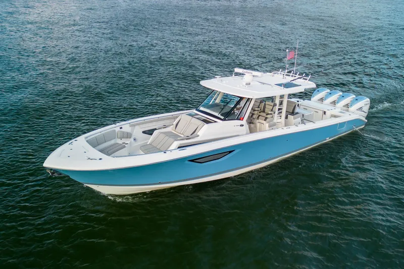 The Image of 2022 Pursuit S 428 Sport boat cruising on open water. - 1