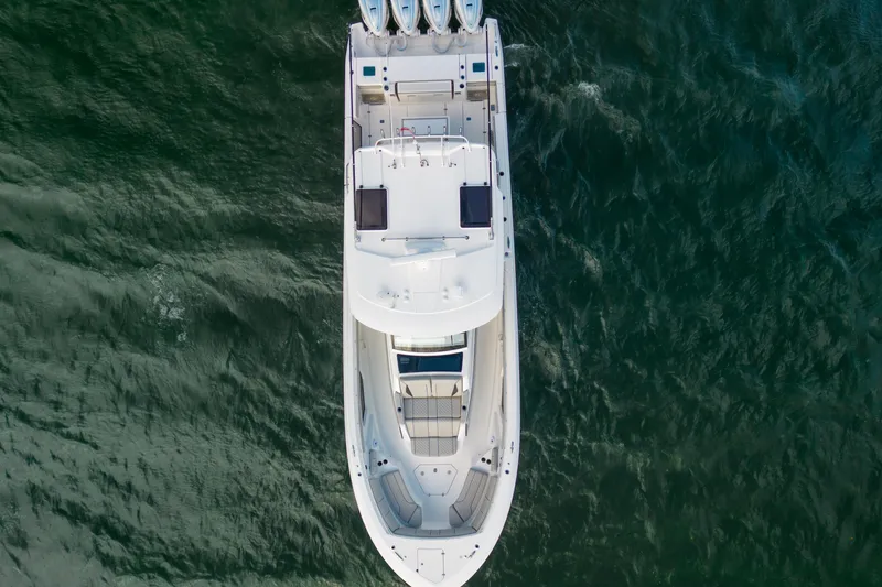 Slide: The Image of Overhead view of 2022 Pursuit S 428 Sport boat on water. - 11