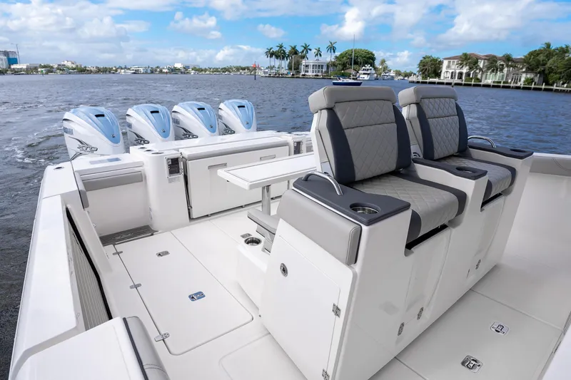 Slide: The Image of 2022 Pursuit S 428 Sport boat interior with luxury seating and quad engines. - 17