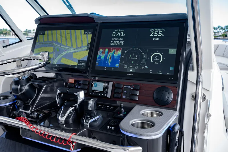 Slide: The Image of Dashboard of 2022 Pursuit S 428 Sport boat with advanced navigation displays. - 21