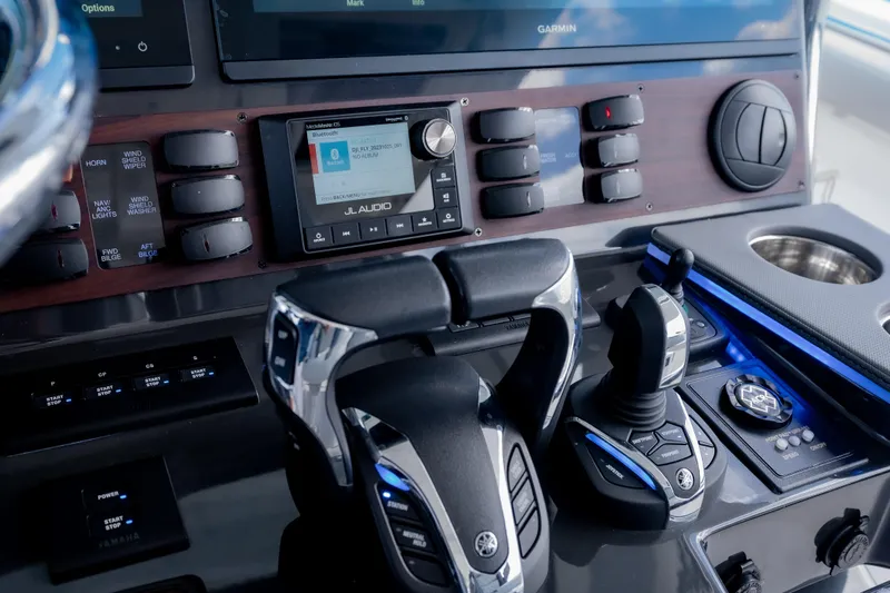 Slide: The Image of Control panel of 2022 Pursuit S 428 Sport boat with advanced navigation and audio systems. - 22