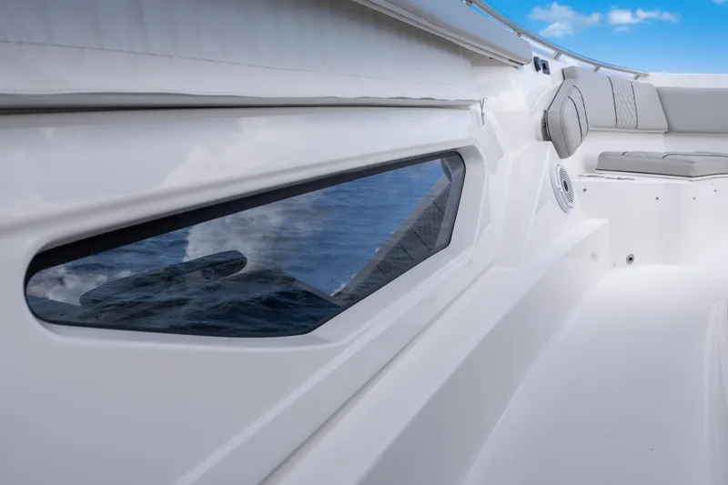 Slide: The Image of 2022 Pursuit S 428 Sport boat interior with sleek design and comfortable seating. - 29