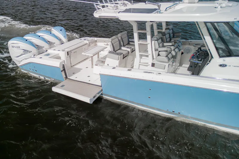 Slide: The Image of 2022 Pursuit S 428 Sport boat with Yamaha engines on water. - 6