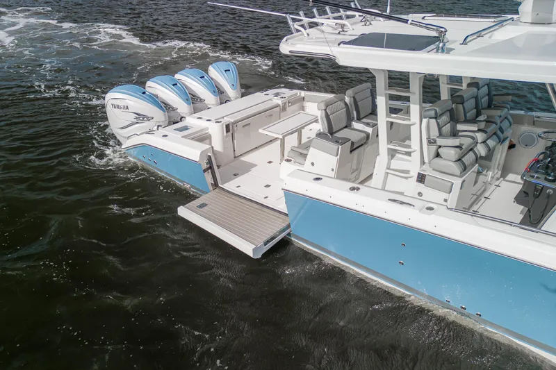 Slide: The Image of 2022 Pursuit S 428 Sport boat with Yamaha engines on water. - 9