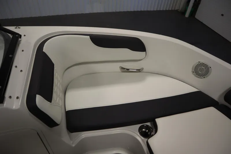 Slide: The Image of 2021 Bayliner VR5 Bowrider OB interior seating with cup holder and speaker. - 13
