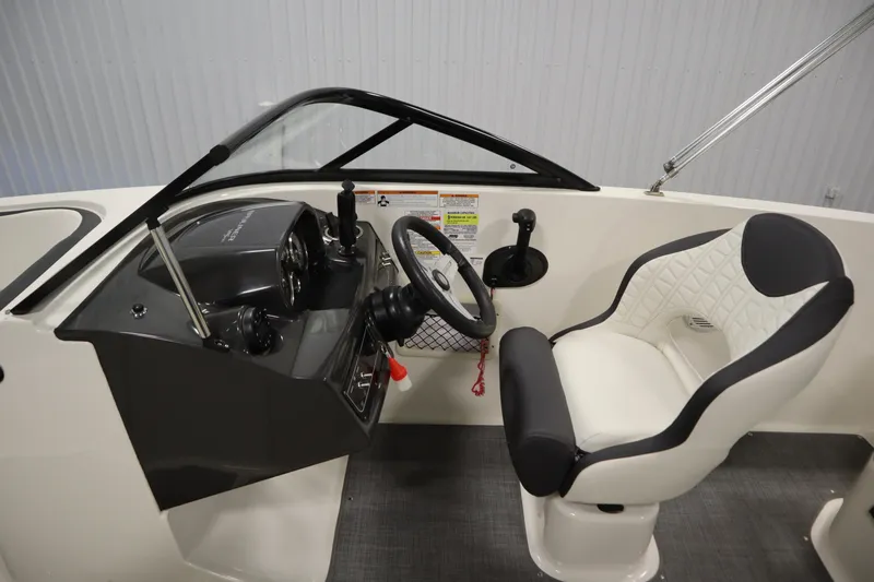 Slide: The Image of 2021 Bayliner VR5 Bowrider OB cockpit with steering wheel and captain's chair. - 17